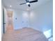 Spacious bedroom with hardwood floors and ceiling fan at 211 Iroquois Ct, Covington, GA 30014