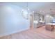 Elegant dining room features a chandelier and hardwood floors at 211 Iroquois Ct, Covington, GA 30014