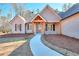 Welcoming front entry with walkway leading to front door at 211 Iroquois Ct, Covington, GA 30014