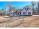 Two-story brick house with front yard and driveway at 211 Iroquois Ct, Covington, GA 30014