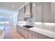 Modern kitchen with gray cabinets, quartz countertops, and gas range at 211 Iroquois Ct, Covington, GA 30014