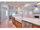 Gourmet kitchen with island, stainless steel appliances, and white quartz countertops at 211 Iroquois Ct, Covington, GA 30014