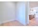 Bright laundry room with built-in cabinets and wood flooring at 211 Iroquois Ct, Covington, GA 30014