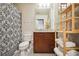 Well-lit bathroom featuring a decorative shower curtain, wooden vanity, and modern fixtures at 361 17Th Nw St # 2208, Atlanta, GA 30363