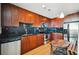 Modern kitchen with stainless steel appliances, dark cabinets and backsplash, and a small dining area at 361 17Th Nw St # 2208, Atlanta, GA 30363