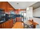 Modern kitchen with dark wood cabinets and stainless steel appliances at 361 17Th Nw St # 2208, Atlanta, GA 30363