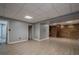 Spacious finished basement with vinyl flooring and storage at 4706 Warrior Se Way, Mableton, GA 30126