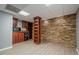 Finished basement featuring a wet bar and stone accent wall at 4706 Warrior Se Way, Mableton, GA 30126