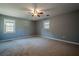 Large bedroom with ceiling fan and neutral colored carpet at 4706 Warrior Se Way, Mableton, GA 30126