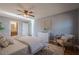 Cozy bedroom with ceiling fan, chair, white dresser, and ensuite bathroom at 4706 Warrior Se Way, Mableton, GA 30126