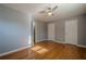 Bedroom with hardwood floors, ceiling fan and multiple closets at 4706 Warrior Se Way, Mableton, GA 30126