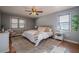 Relaxing bedroom with ceiling fan and hardwood floors at 4706 Warrior Se Way, Mableton, GA 30126