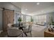 Open concept dining area with a barn door and stylish table at 4706 Warrior Se Way, Mableton, GA 30126