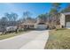 House exterior featuring a driveway and attached garage at 4706 Warrior Se Way, Mableton, GA 30126