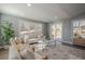 Sunlit living room with sliding glass doors leading to backyard at 4706 Warrior Se Way, Mableton, GA 30126