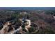 Find your dream home and enjoy a peaceful setting with this aerial shot of a property surrounded by trees at 1560 Tapestry Rdg, Lawrenceville, GA 30045