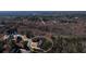 An impressive aerial view shows a well-maintained home with lush surroundings at 1560 Tapestry Rdg, Lawrenceville, GA 30045
