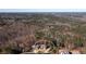 Overhead view showcasing the home's location, backyard, and wooded surroundings at 1560 Tapestry Rdg, Lawrenceville, GA 30045