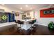 Charming home bar featuring a white countertop with seating, stainless steel appliances, and hardwood floors, perfect for entertaining at 1560 Tapestry Rdg, Lawrenceville, GA 30045