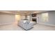 Finished basement with grey sofa, a fireplace, and recessed lighting at 1560 Tapestry Rdg, Lawrenceville, GA 30045