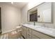 Elegant bathroom featuring a double vanity with marble countertop, modern faucets, and tiled floors, offering a luxurious feel at 1560 Tapestry Rdg, Lawrenceville, GA 30045