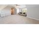 A large bedroom has a couch and windows that bring in natural light at 1560 Tapestry Rdg, Lawrenceville, GA 30045