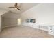 Bedroom with ceiling fan and wall mounted tvs, a desk and carpeted floors at 1560 Tapestry Rdg, Lawrenceville, GA 30045