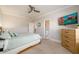Bedroom with bed, dresser, ceiling fan and view to ensuite bathroom at 1560 Tapestry Rdg, Lawrenceville, GA 30045
