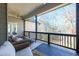 Relaxing covered deck with comfortable seating and serene views of the surrounding trees at 1560 Tapestry Rdg, Lawrenceville, GA 30045