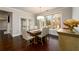 Lovely dining room features hardwood flooring, a chandelier, and views of the exterior landscape at 1560 Tapestry Rdg, Lawrenceville, GA 30045