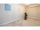 Versatile exercise room with neutral paint, carpeted floor, and natural light, ideal for maintaining an active lifestyle at home at 1560 Tapestry Rdg, Lawrenceville, GA 30045