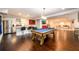 Entertainment space featuring a pool table and a kitchen, perfect for gatherings and leisure activities at 1560 Tapestry Rdg, Lawrenceville, GA 30045