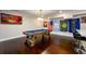 Open game room with a pool table, flags and nearby wet bar, offering an inviting entertainment space at 1560 Tapestry Rdg, Lawrenceville, GA 30045