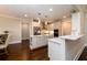 Gourmet kitchen boasts white cabinetry, stainless appliances, marble counters and convenient center island at 1560 Tapestry Rdg, Lawrenceville, GA 30045