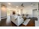 Spacious living room featuring hardwood floors, neutral furniture, open layout, and lots of natural light at 1560 Tapestry Rdg, Lawrenceville, GA 30045