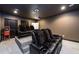 Cozy home theater features tiered seating, leather recliners, and a classic popcorn machine at 1560 Tapestry Rdg, Lawrenceville, GA 30045