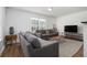 Comfortable living room with hardwood floors, a gray sofa, and plenty of natural light at 93 Terry St # A, Atlanta, GA 30312