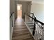 Bright hallway with wood floors and staircase leading to the second floor at 1074 Bradshaw Estates Dr, Canton, GA 30115