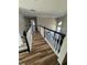 Upstairs hallway with nice railings overlooking the downstairs area with large bright windows at 1074 Bradshaw Estates Dr, Canton, GA 30115