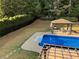 Beautiful pool, enhanced by lush greenery and a charming gazebo, perfect for relaxing at 1074 Bradshaw Estates Dr, Canton, GA 30115