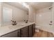 Double vanity bathroom with shower and tub at 1414 Alcovy Station Rd, Covington, GA 30014