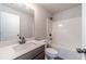 A bathroom is equipped with a modern vanity, toilet, and shower-tub combo at 1422 Alcovy Station Rd, Covington, GA 30014