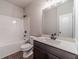 A well-lit bathroom features a vanity, toilet and bathtub with a shower at 1422 Alcovy Station Rd, Covington, GA 30014