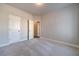 This spacious bedroom features neutral walls, plush carpet and two closets at 1422 Alcovy Station Rd, Covington, GA 30014