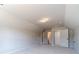 The bonus room is large and well-lit with neutral walls and carpet at 1422 Alcovy Station Rd, Covington, GA 30014