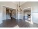Bright living room features wood floors, white trim, elegant lighting, and an open layout to the rest of the house at 1422 Alcovy Station Rd, Covington, GA 30014