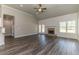 Living room features a brick fireplace and shiplap wall at 1422 Alcovy Station Rd, Covington, GA 30014