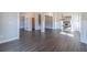 Spacious living room features wood floors, white trim, elegant lighting, and an open layout to other living spaces at 1422 Alcovy Station Rd, Covington, GA 30014