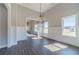 Bright living room features wood floors, white trim, elegant lighting, and an open layout to the rest of the house at 1422 Alcovy Station Rd, Covington, GA 30014