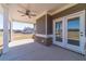 Covered patio with brick accents, ceiling fan, and an open view to the backyard at 1422 Alcovy Station Rd, Covington, GA 30014